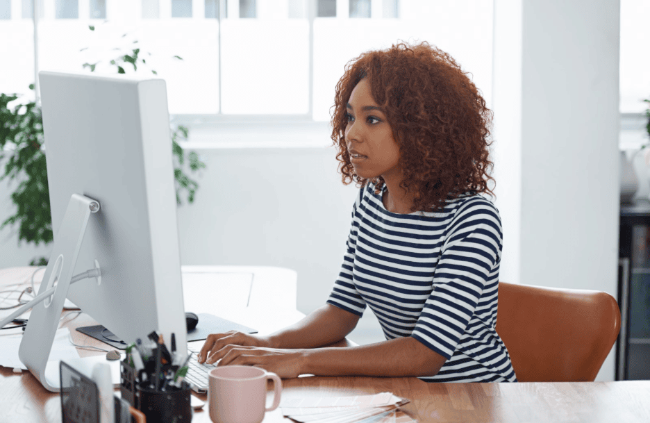 nonprofit leader sitting at desk working on grant proposals