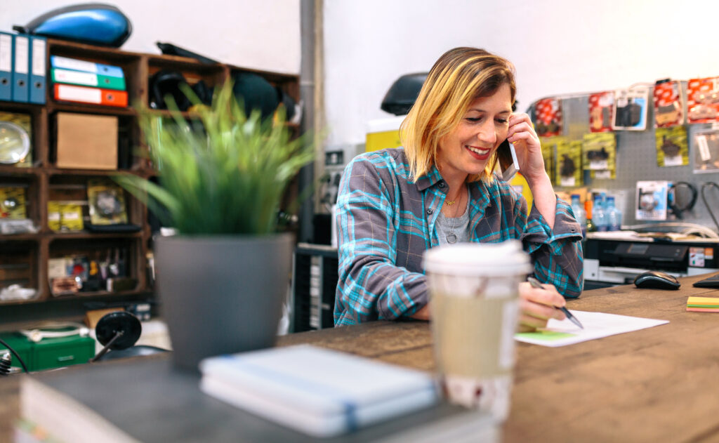Nonprofit executive writing down questions for a foundation
